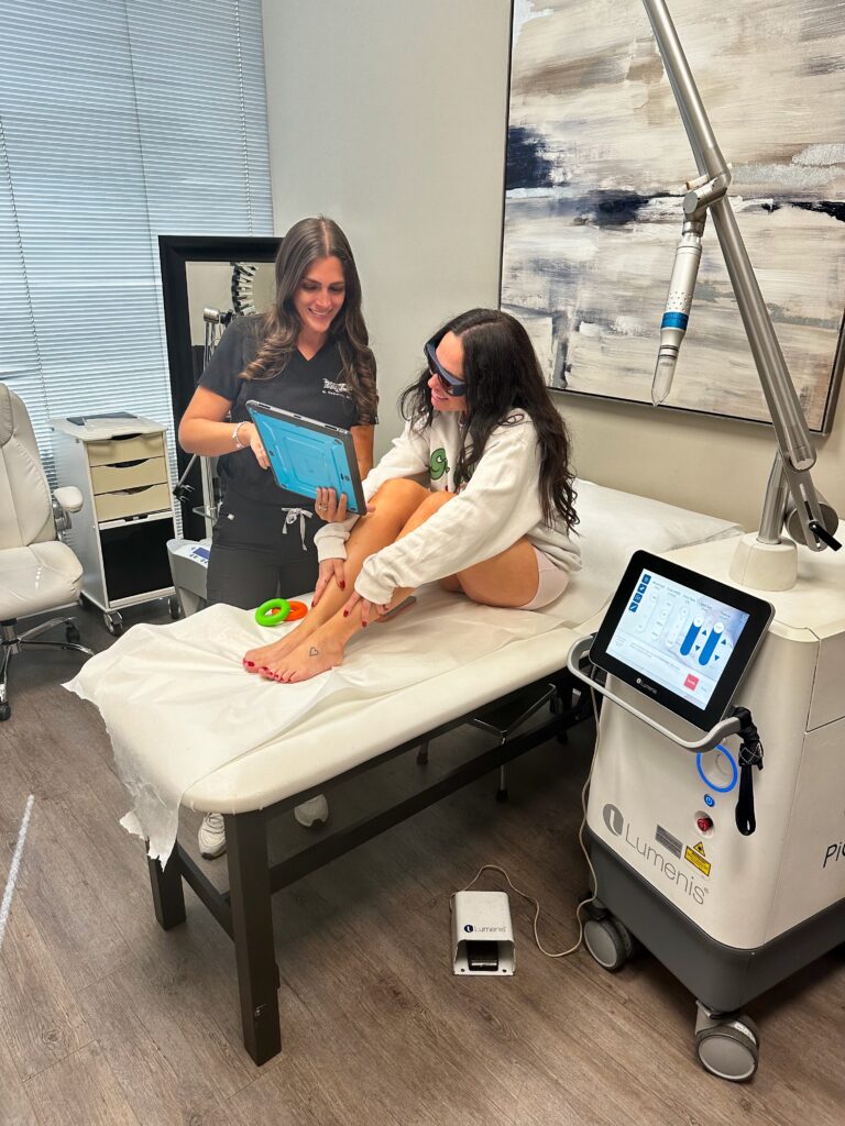 EradiTatt specialist performing Piqo4 laser tattoo removal during a first treatment session.