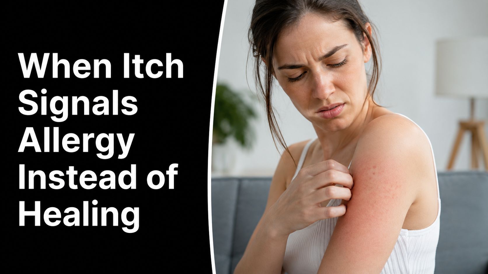 A woman looks concerned while scratching the red, irritated skin on her upper arm in a room.