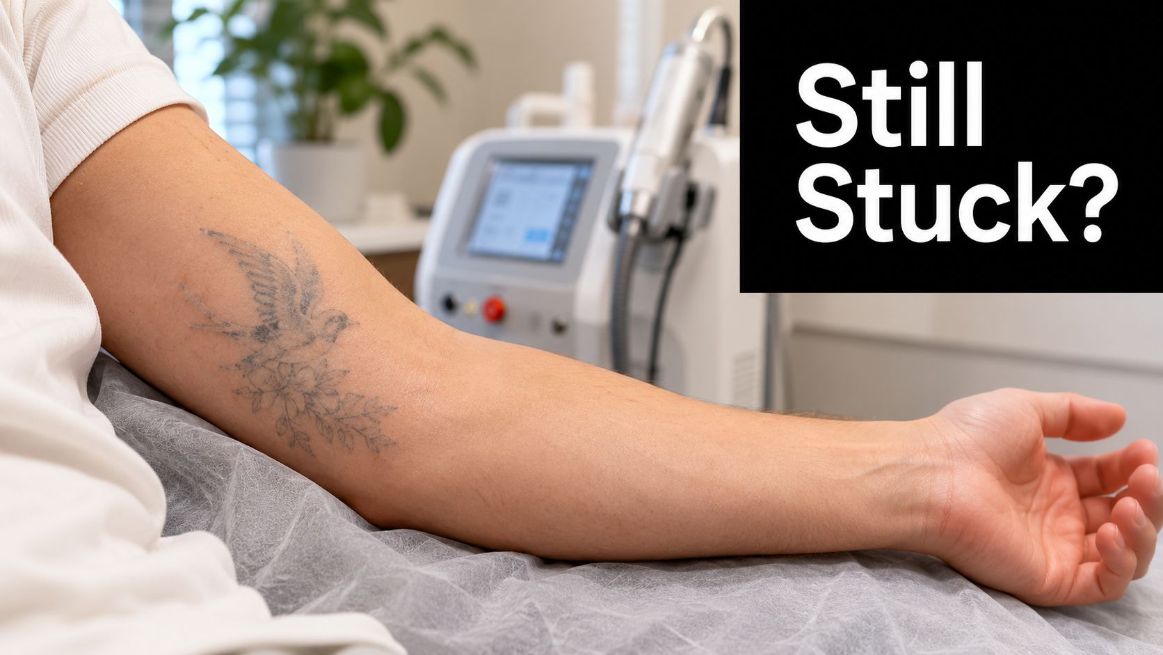 A person lying down at a clinic to prepare for a laser tattoo removal treatment session.
